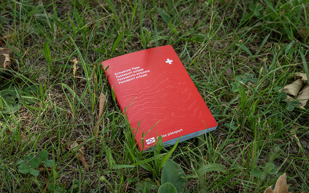 The Swiss passport fallen on the lawn